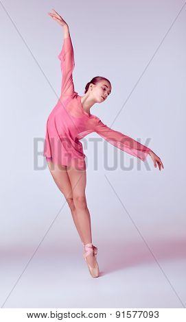 Young ballerina dancer showing her techniques