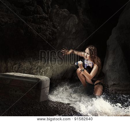 Woman Traveler In Sea Cave With Tresure Chest