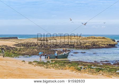 OUALIDIA, MOROCCO, APRIL 6, 2015: Fishermen  go to sea in fishing boat