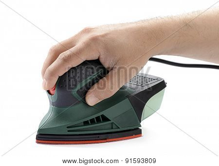 Carpenter's hand sanding with electrical sander isolated on white background. 