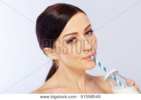 young woman with a glass of milk