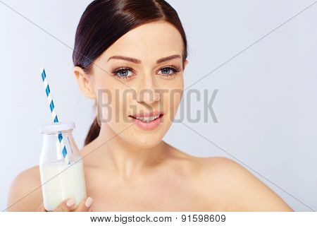 young woman with a glass of milk