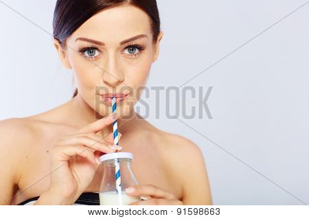 young woman with a glass of milk