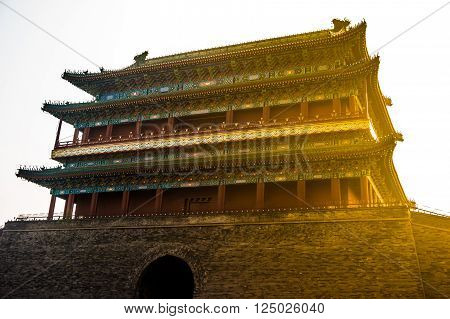 Beijing, China at the Zhengyangmen Gatehouse in Tiananmen Square. Beautiful historical building at sunset.