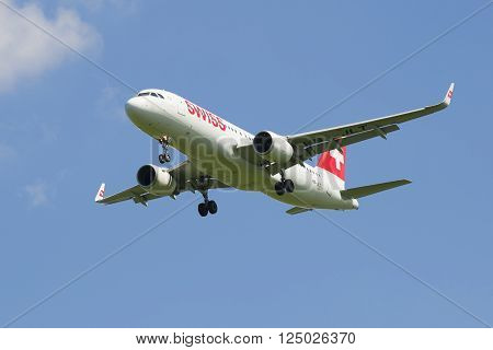 ST. PETERSBURG, RUSSIA - JUNE 29, 2015: Airbus A320 (HB-JLT) Swiss International Air Lines landing in Pulkovo airport