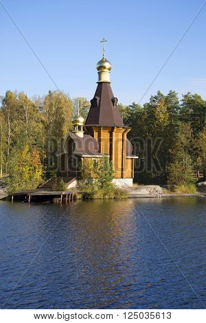 The wooden Church of the Apostle Andrew on Vuoksa gold autumn. Leningrad region, Russia