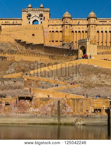 JAIPUR INDIA - 22ND MARCH 2016: The outside of the Amber Fort in Jaipur Rajasthan India. Elephants and people can be seen.