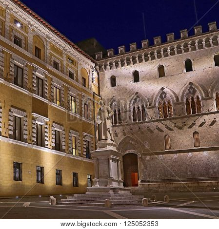 SIENA ITALY - MARCH 11 2016: Sallustio Bandini on Piazza Salimbeni at night Siena Tuscany - Italy.
** Note: Soft Focus at 100%, best at smaller sizes