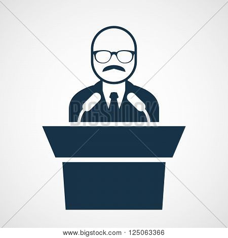 Bald-headed man at rostrum - speaker in glasses at tribune