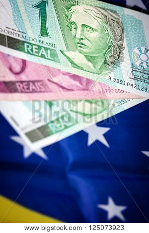different rasil bank notes on a brasilian flag