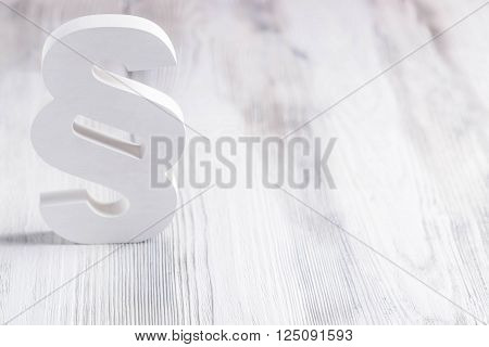 White wooden paragraph the symbol of law on old wooden floor. Law concept
** Note: Shallow depth of field