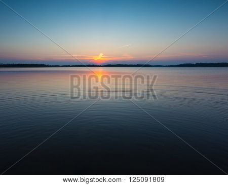 Beautiful and colorful lake landscape. Lake in Mazury lake district in Poland.
