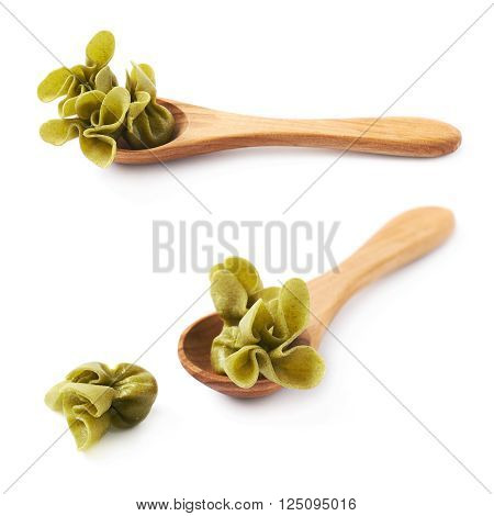 Wooden spoon full of sacchettoni stuffed pasta isolated over the white background, set of two different foreshortenings