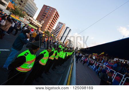Quito, Ecuador - April 7, 2016: Police awaiting overlooking peaceful anti tax march in Shyris Avenue. Anti Rafael Correa goverment protestors.