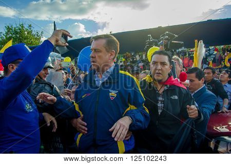 Quito, Ecuador - April 7, 2016: Closeup opposition leader Andres Paez surrounded by people, police and journalists during anti government protests in Shyris Avenue.