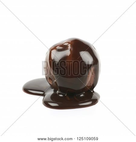 Chocolate ball candy coated with the hot liquid chocolate, composition isolated over the white background