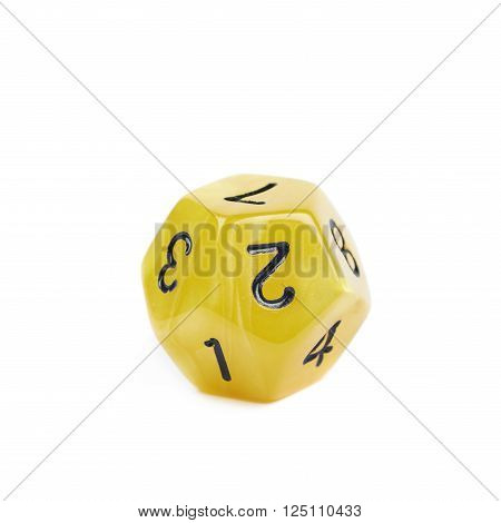 Yellow roleplaying polyhedral dodecahedron gaming plastic dice isolated over the white background