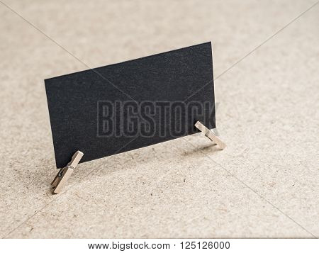 Back textured business card with clothes pins