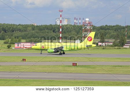 ST. PETERSBURG, RUSSIA - JULY 27, 2015: The plane of the company S7 Siberia Airlines Airbus A319 (VP-BHP) on the runway of the Pulkovo airport