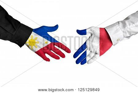 Philippines and France leaders shaking hands on a deal agreement