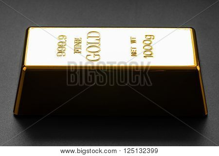 closeup of gold bullion on a dark background