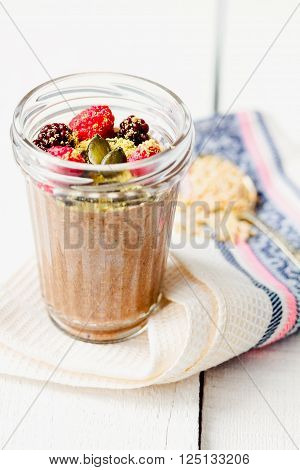 Oatmeal Chocolate Mousse With Berries And Pumpkin Seeds