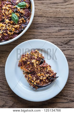 Dish and portion of Parmigiana di melanzane: top view