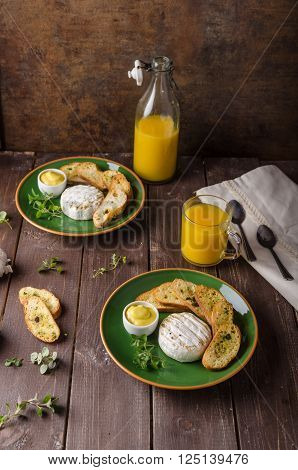 Grilled camembert with toast and juice fresh toasted baquette with herbs and delicious dijon mustard. Beautiful melted cheese.