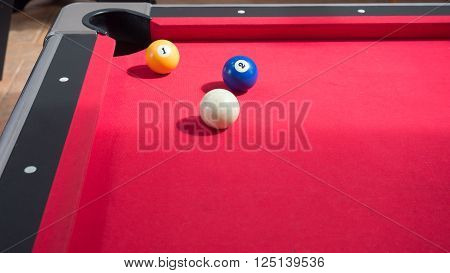 Game of american billiards  played on a billiard table for two persons