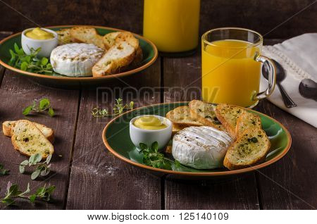 Grilled camembert with toast and juice fresh toasted baquette with herbs and delicious dijon mustard. Beautiful melted cheese.