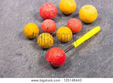 Carp Hook Boilies on black background. Close Up.
** Note: Shallow depth of field