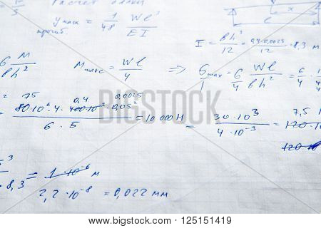 Squared sheet of paper filled with trigonometry math equations and formulas