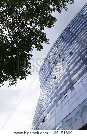 VIENNA, AUSTRIA - MAY 7: Modern buildings in front of Gasometers of Vienna in Austria on 7 May 2012 in Vienna, Austria.