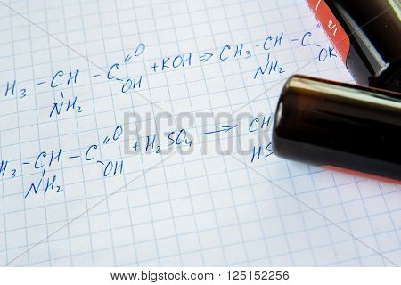 Chemistry science formulas on squared sheet of paper