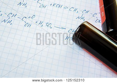 Chemistry science formulas on squared sheet of paper
