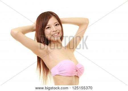 Japanese woman posing in a pink bikini