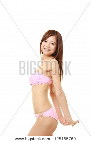 Japanese woman posing in a pink bikini