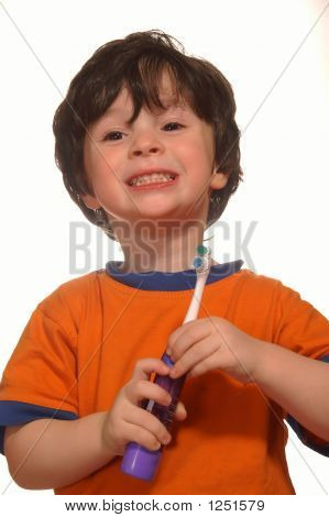 The Boy With A Toothbrush In He'S Hands