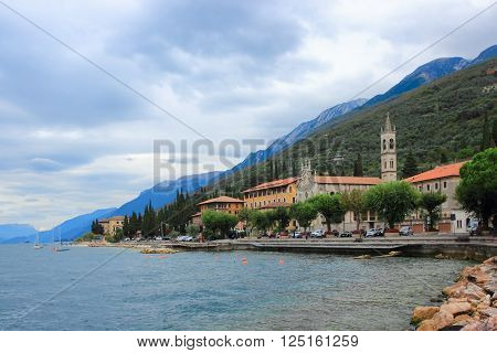 Castelletto, Italy, 01 October 2015: Promenade of town Castelletto with a chapel, cathedral and mountains in the back, Italy