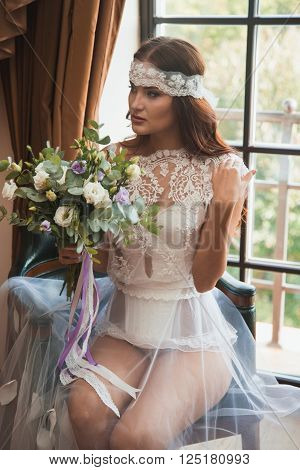 Beautiful sexy girl in boudoir white dress
