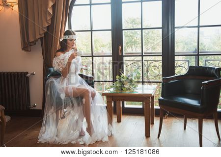 Beautiful sexy girl in boudoir white dress