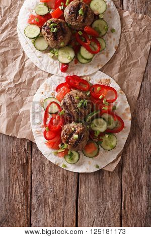 Grilled Meat Balls With Fresh Vegetables On A Flat Bread. Vertical Top View