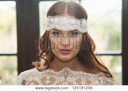Beautiful sexy girl in boudoir white dress