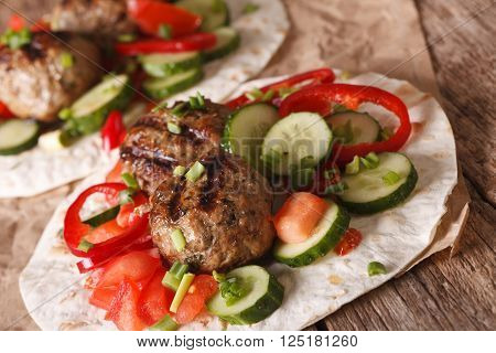 Arabian Food: Meat Balls With Fresh Vegetables On A Flat Bread Closeup. Horizontal