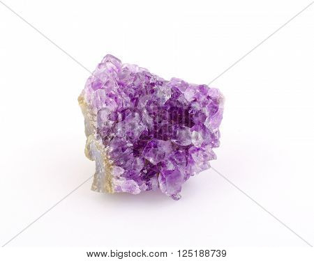 Purple amethyst stone isolated on white (as rough amethyst crystals)