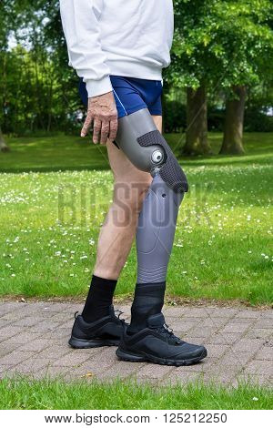 Close Up On Legs Of Man Walking On Path