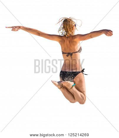 Back of happy and attractive woman with black bikini jumping in the air. Isolated on white background.