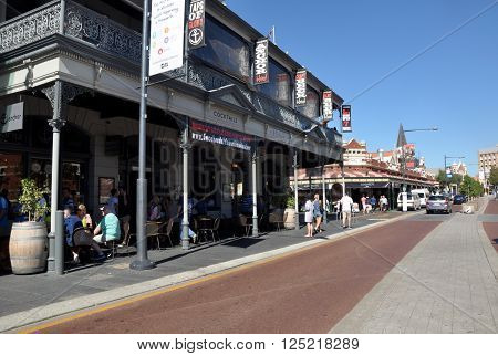 FREMANTLE,WA,AUSTRALIA-FEBRUARY 21,2015: Downtown street with restaurants, people and Fremantle Markets in historic Fremantle, Western Australia.