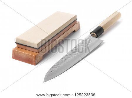 Traditional japanese kitchen knife and grinding water stone. Isolated on white.