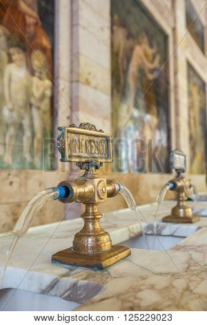 Montecatini Terme, Italy - September 15, 2015: Fountains with the Rinfresco water in Tettuccio Terme spa in Montecatini Terme, Italy